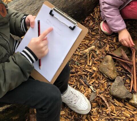 child with clipboard